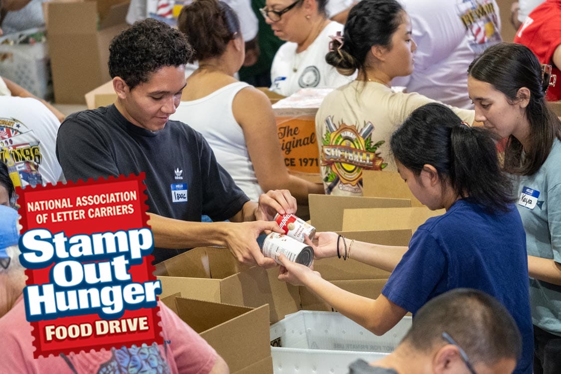 Volunteers pack canned goods at Hawaii Foodbank Stamp Out Hunger food drive